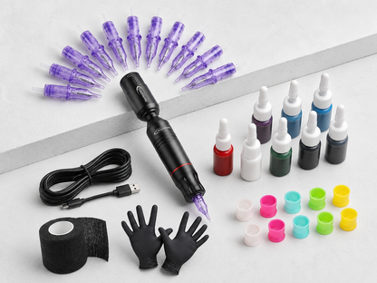 Beginner tattoo starter kit with practice ink, needles, gloves, and ink cups